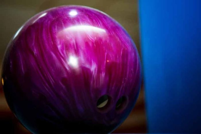 The mass of a bowling ball is 7.25